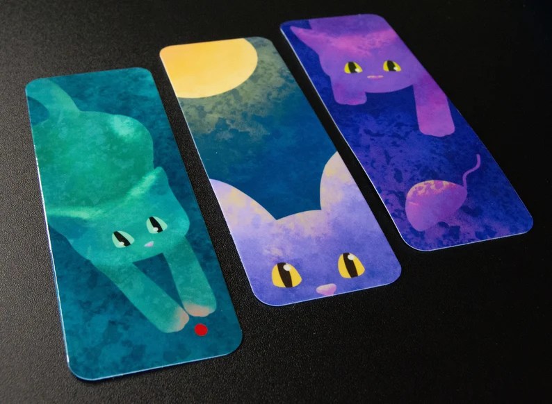 Three bookmarks with cats playing